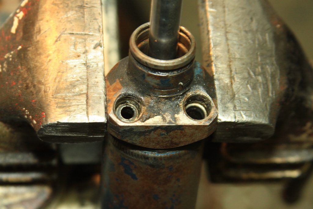 power cylinder in vise with caps removed
