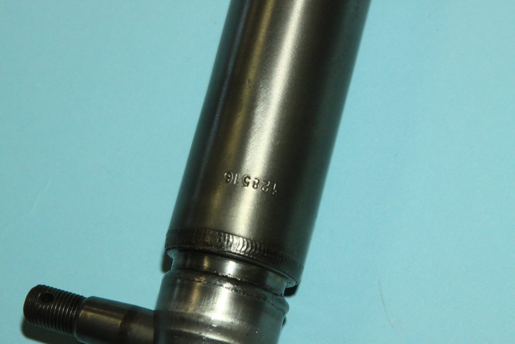 part number stamped on a power steering cylinder