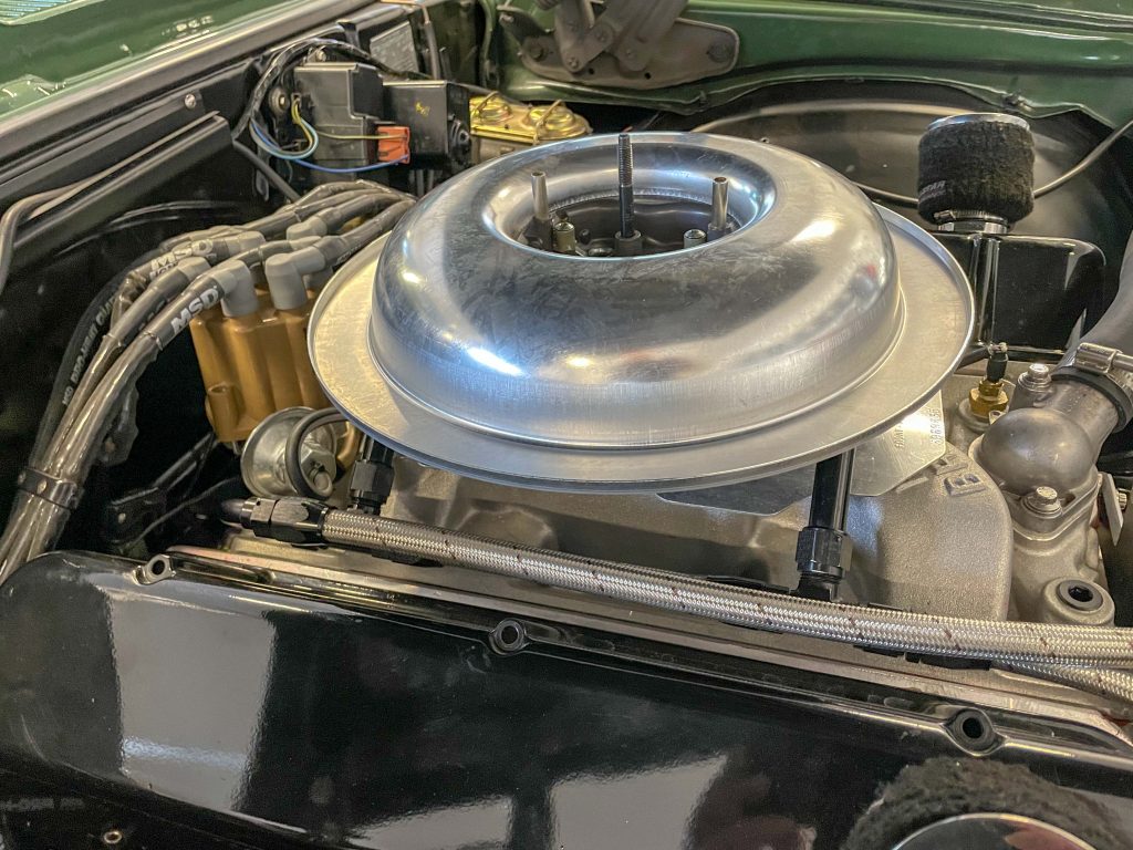a dropped air cleaner base on top of an engine