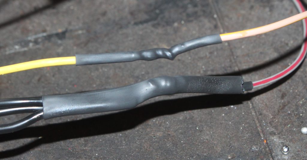 wire splices covered with heat shrink sleeves