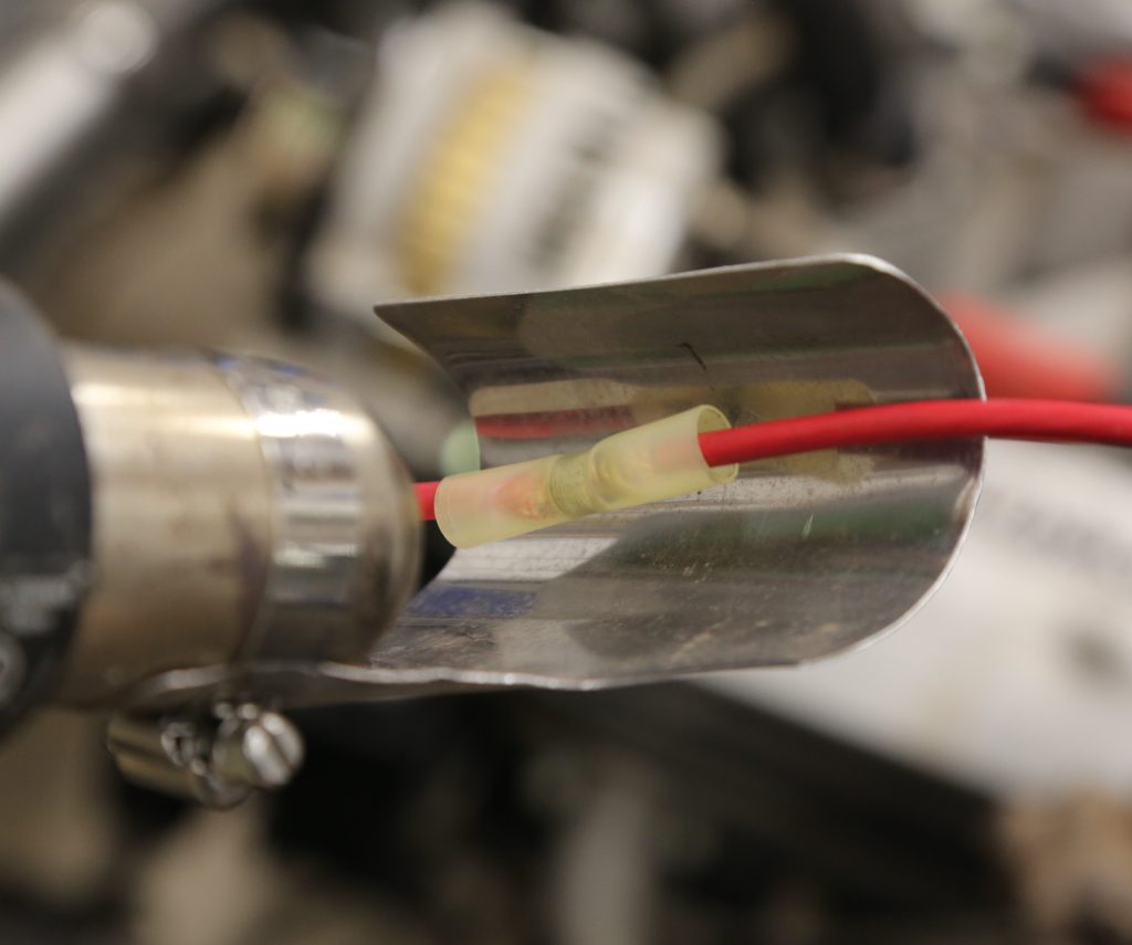 using a heat gun with shrink tubing on a splice