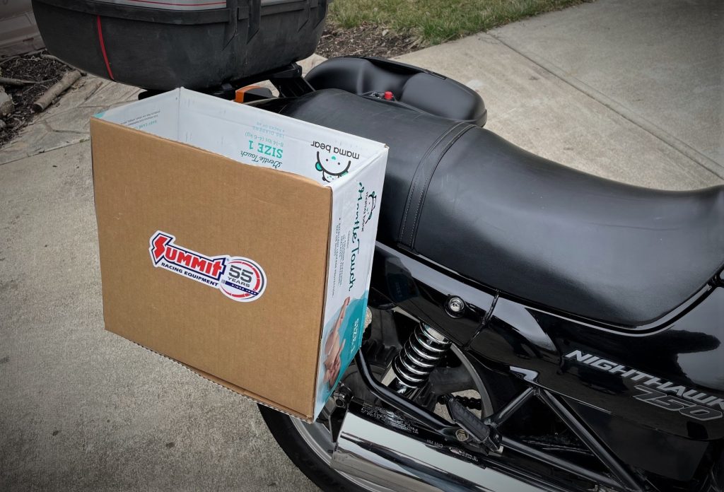 motorcycle with cardboard box luggage  mockup