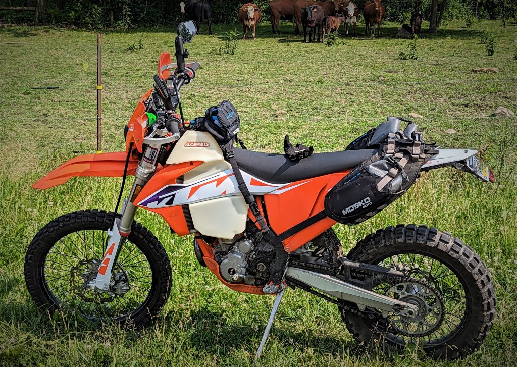 ktm dirt bike with saddelbags and a tank bag