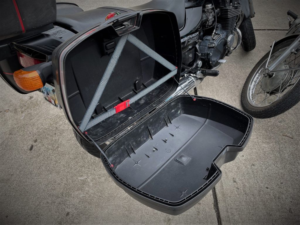 large open clamshell on a motorcycle side case