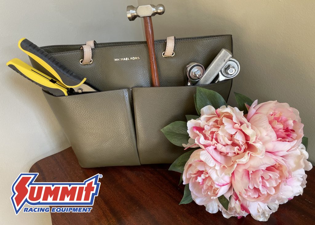tools in a purse with flowers