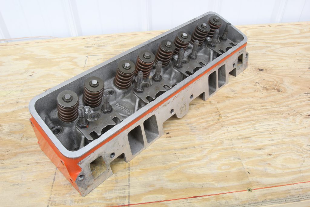 SBC Chevy cylinder head on a workbench