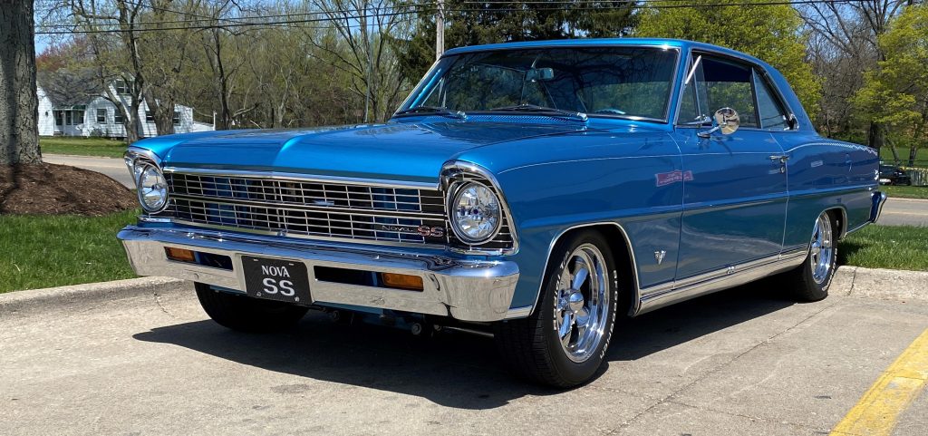 blue 1967 Chevy Nova SS in Summit Racing parking lot
