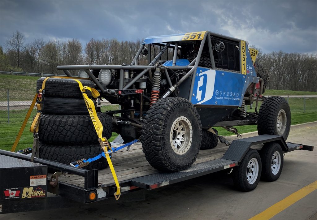Off-road ULTRA4 race buggy on trailer, front right