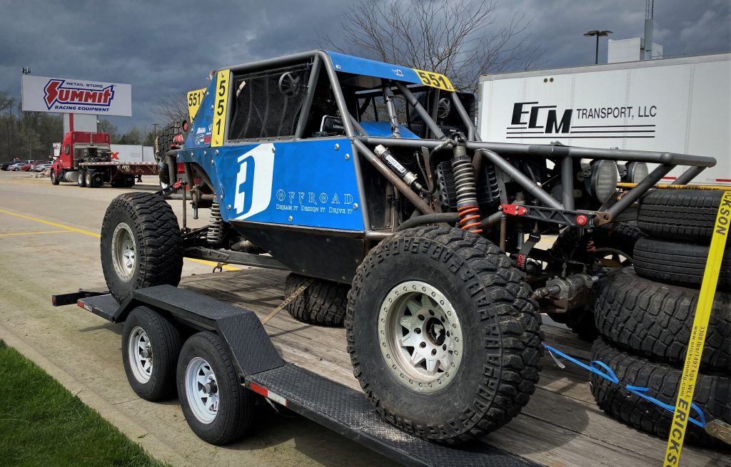 Off-road ULTRA4 race buggy on trailer, front left