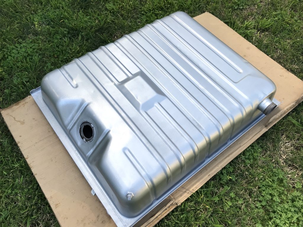 new vehicle fuel tank resting on lawn