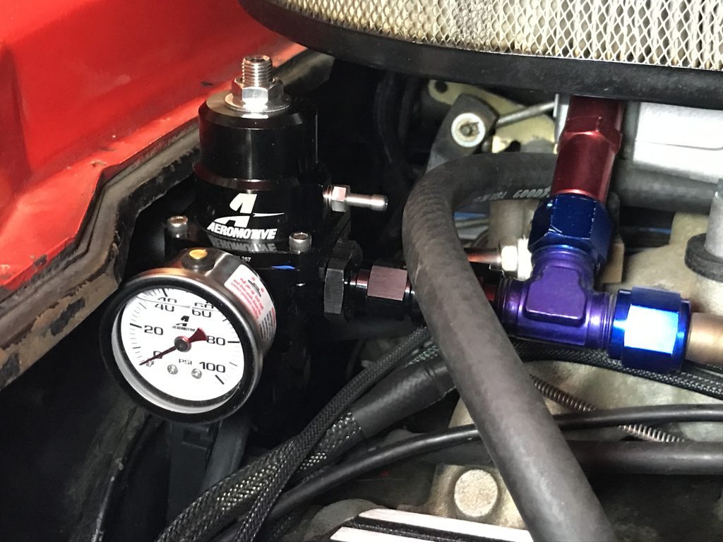 fuel regulator with pressure gauge installed near engine