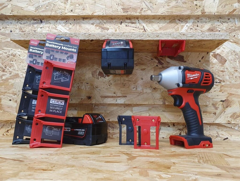 Milwaukee tool batteries mounted to plywood