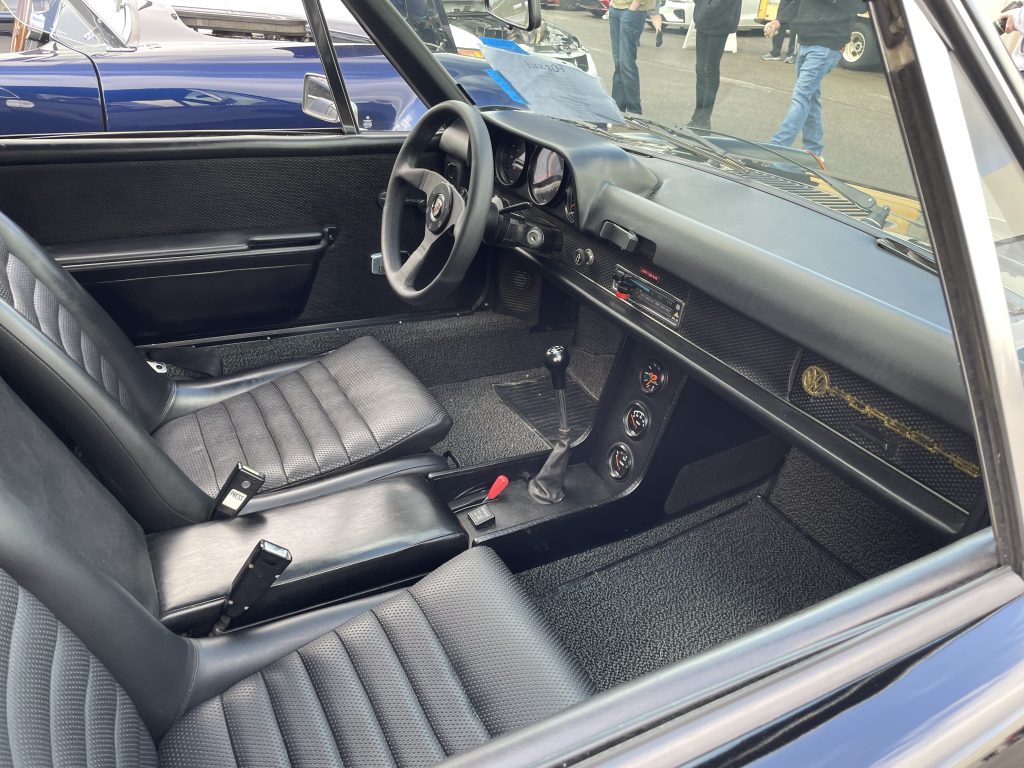 Interior view of a black Porsche 914, passenger side
