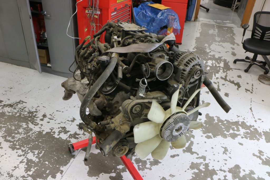 an old 5.3L LS engine on a stand