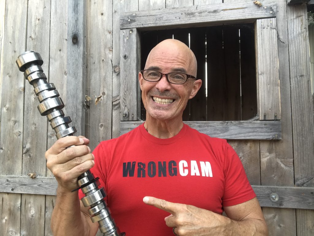 man holding a camshaft