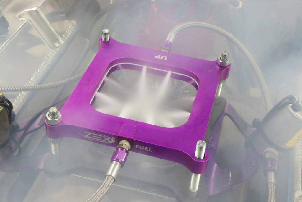 nitrous nozzle plate at full spray on an ls intake manifold