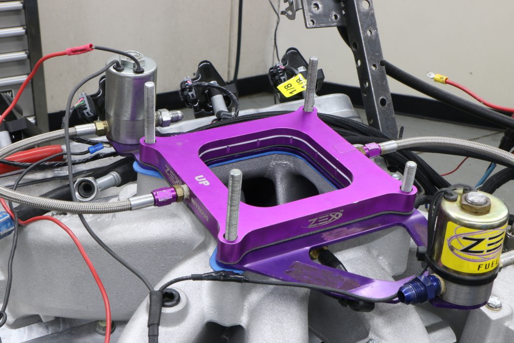 nitrous nozzle plate atop an intake manifold