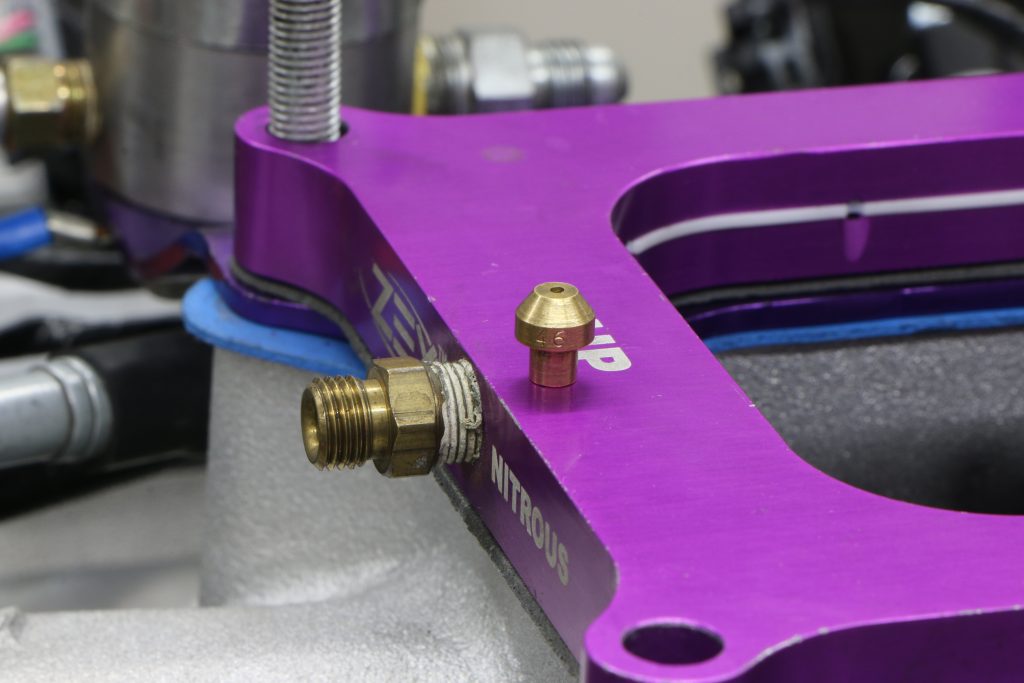 close up of fitting on nitrous nozzle plate