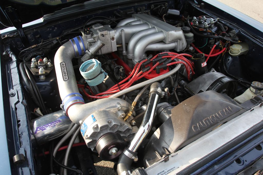 engine inside a ford mustang foxbody drag car