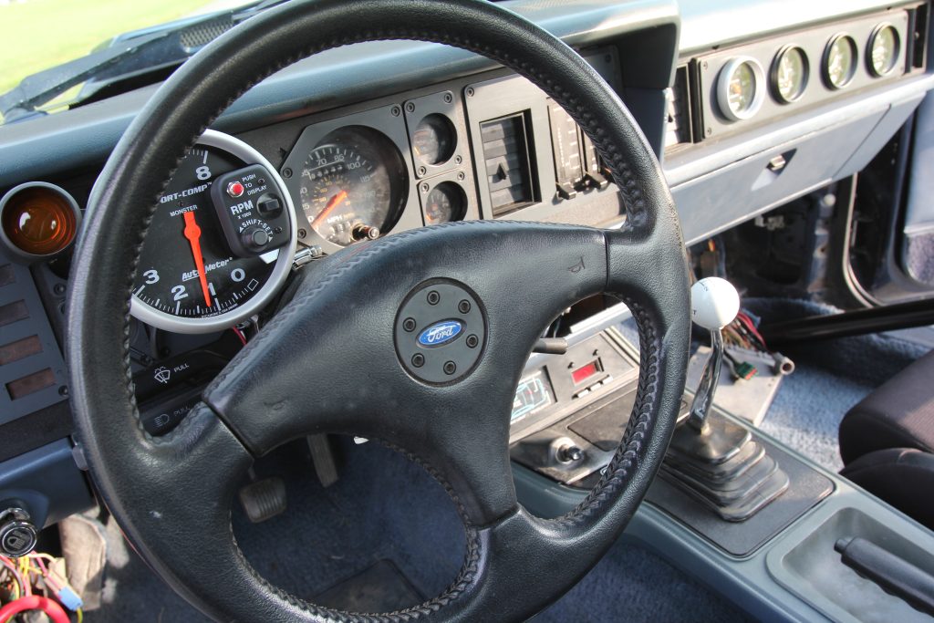 cockpit of a foxbody mustang drag car