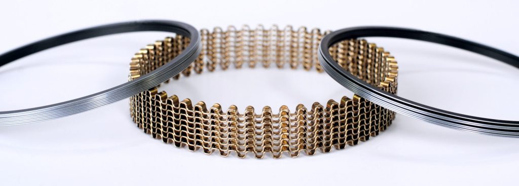 piston rings and a stack of oil rings