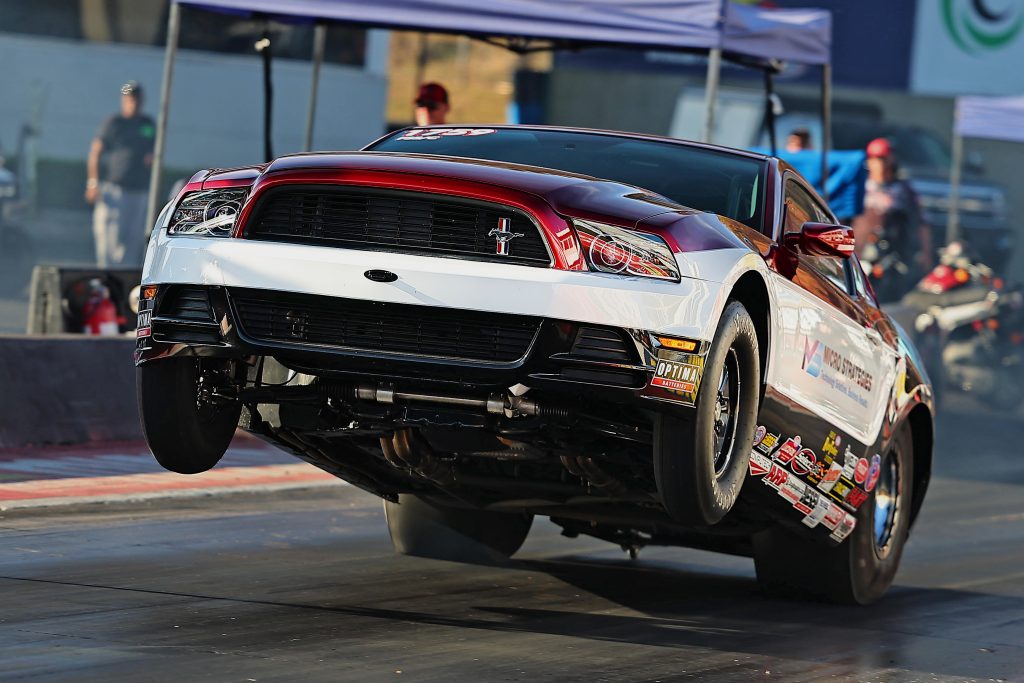mustang race car doing a wheelstand
