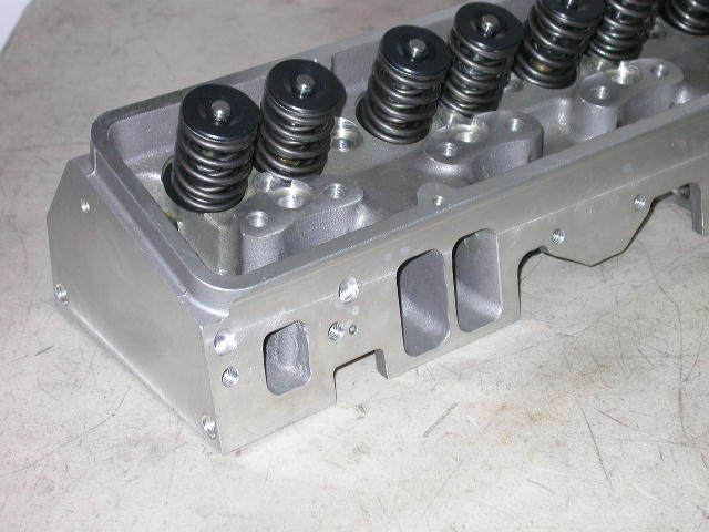 small block chevy cylinder head on table
