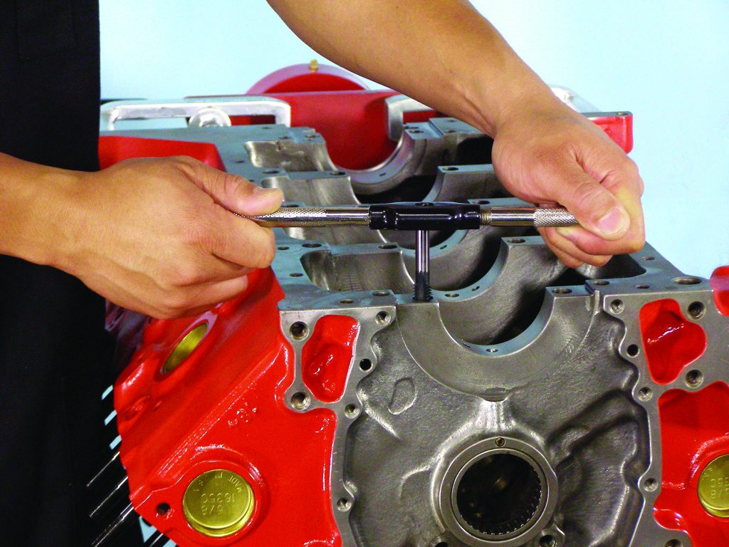 using tap to thread holes in engine block