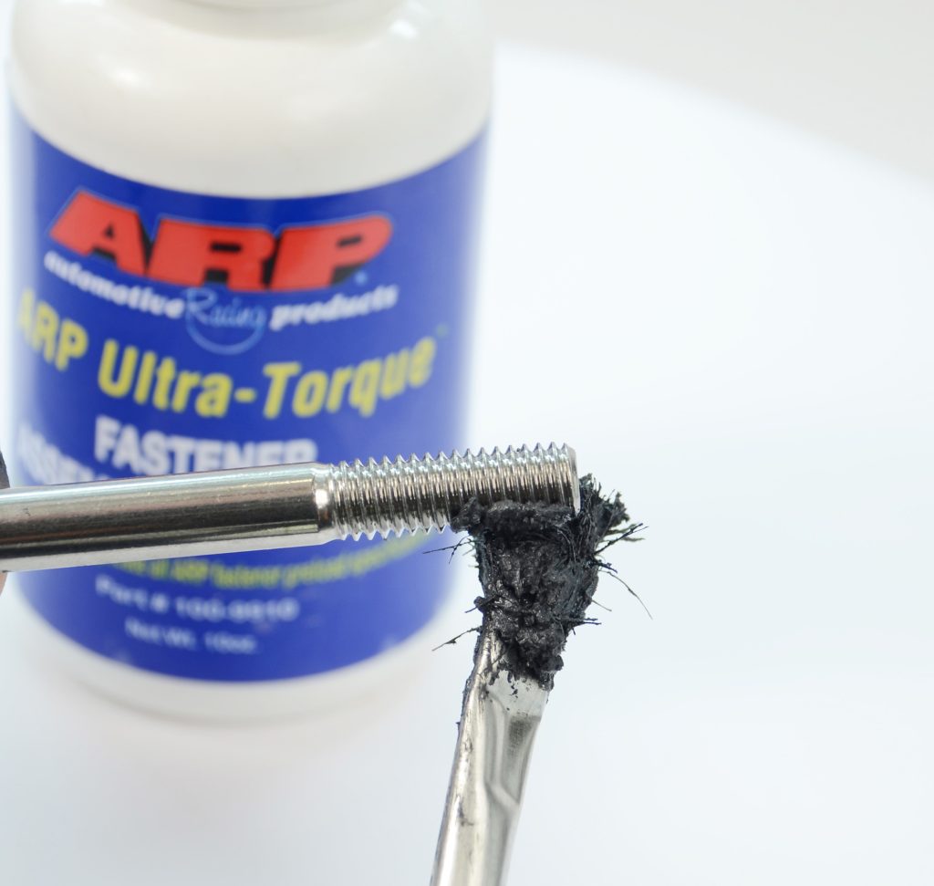 applying thread lube to fastener