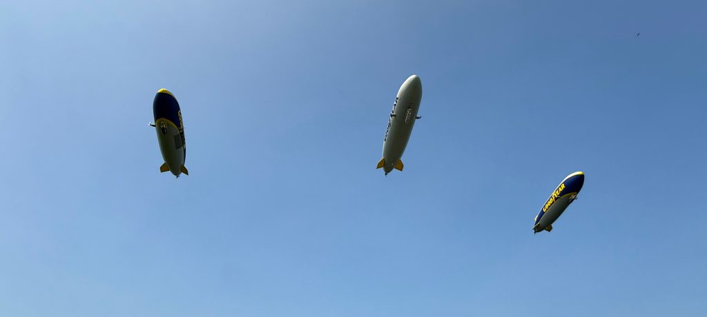 three goodyear blimps floating overhead