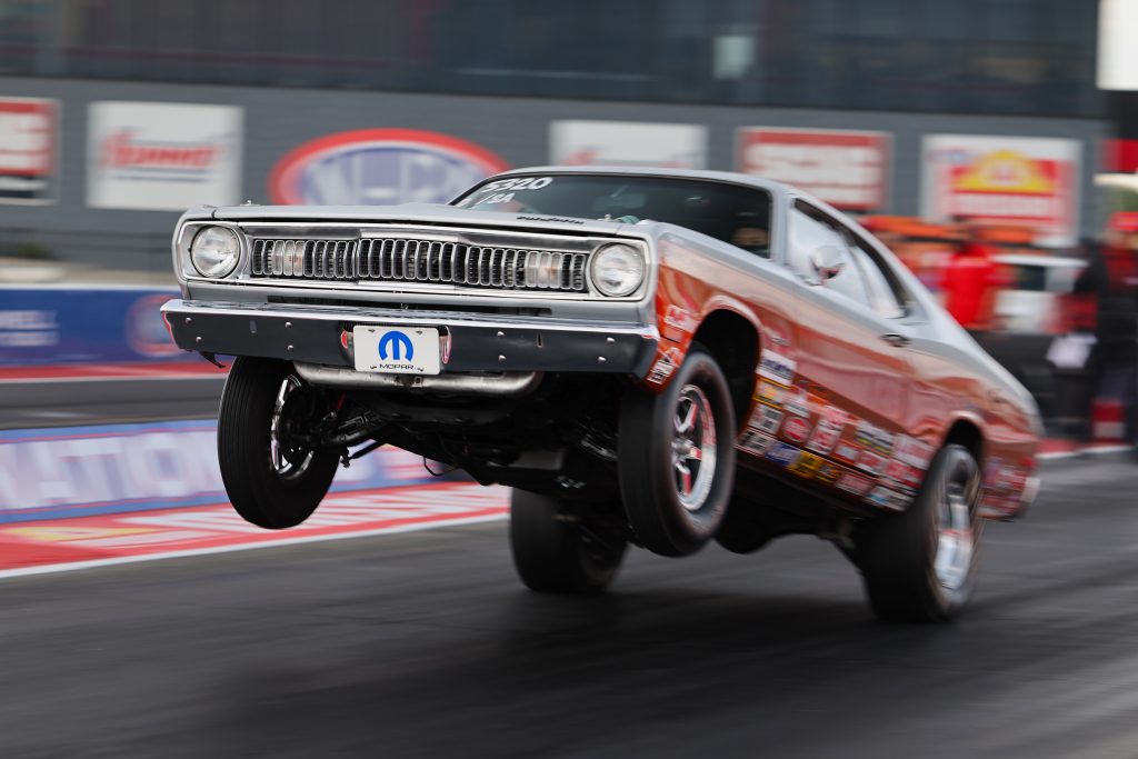 plymouth scamp drag car launching at track