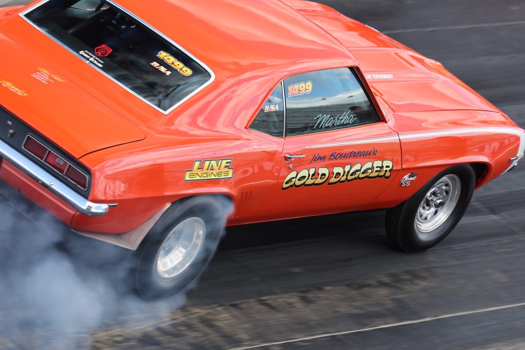 close up of gold digger side art on a drag race camaro
