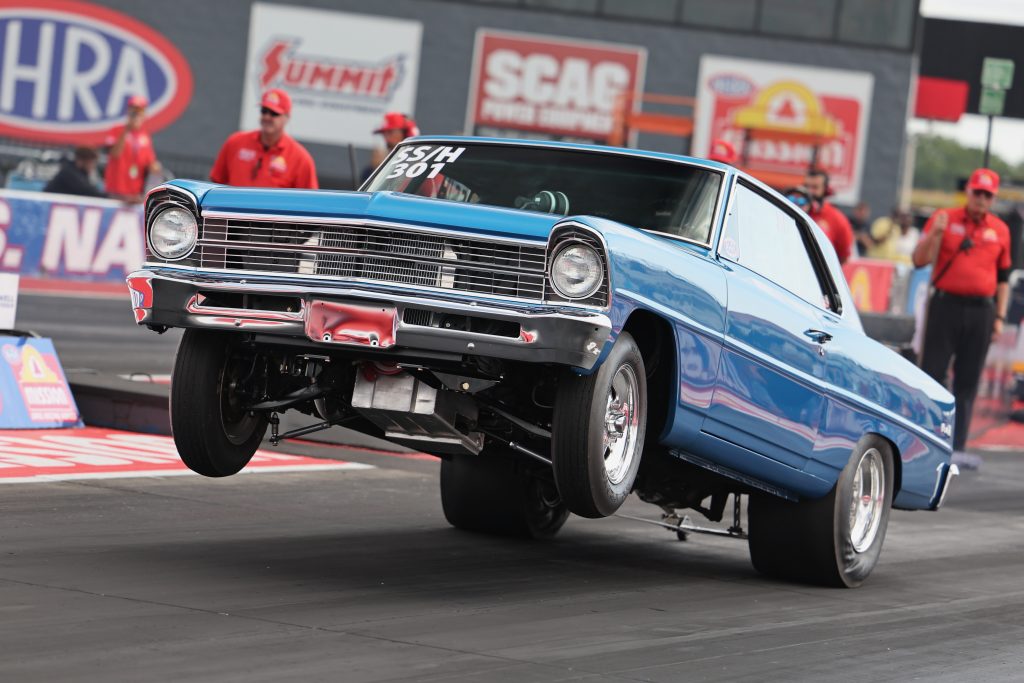 Chevy II Doing wheelstand at drag race launch