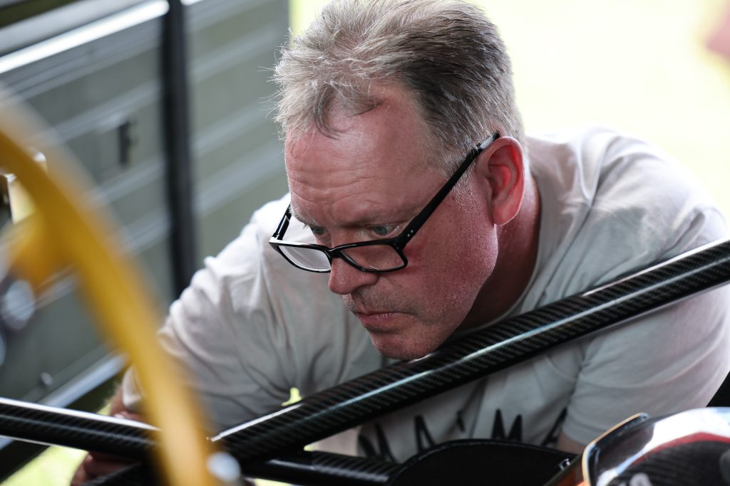 Jason Line working in pits during NHRA Race