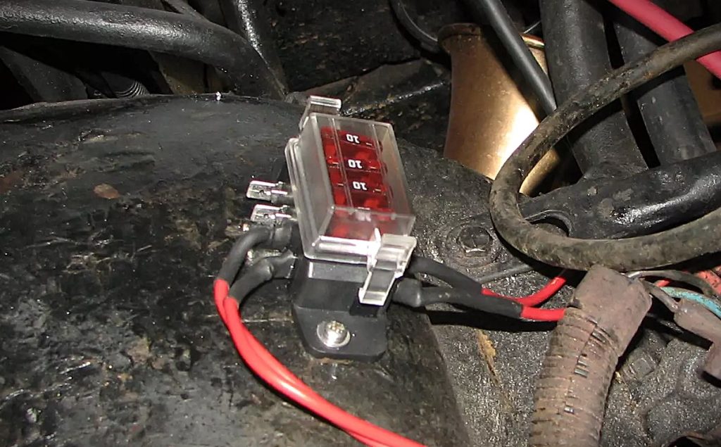 fuse block mounted on a jeep fender