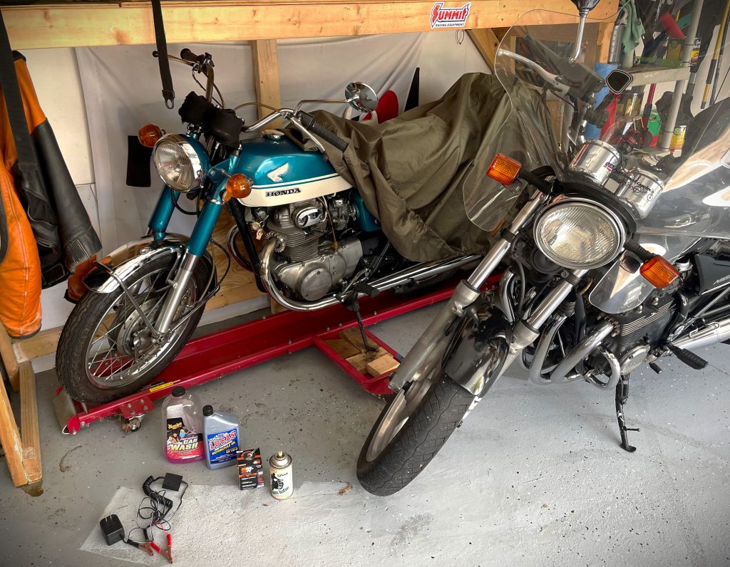 a pair of motorcycles in a garage