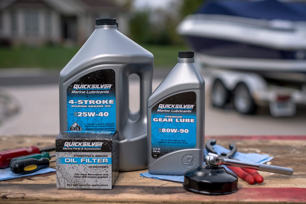 an assortment of quicksilver marine motor oil & lube