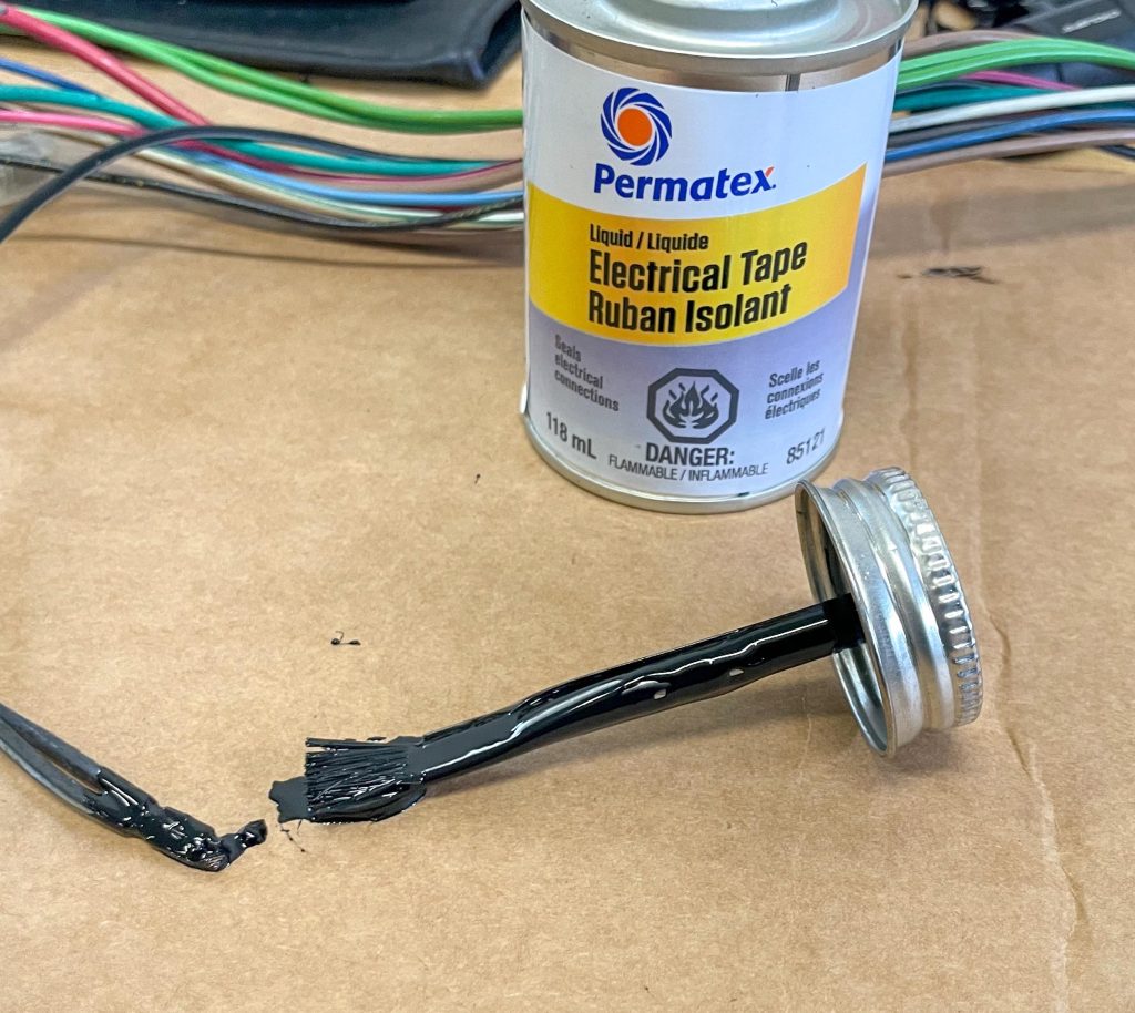 Applying liquid tape to a terminated wire