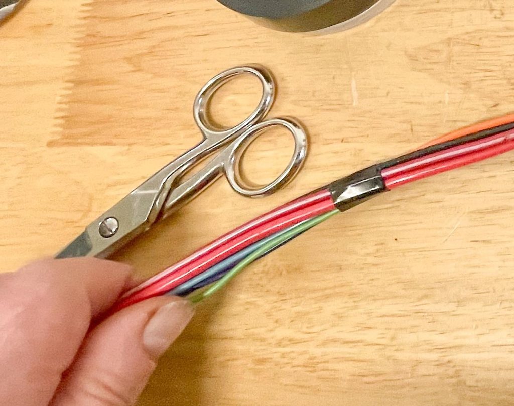 Taping small segments of 1971 Corvette wiring harness