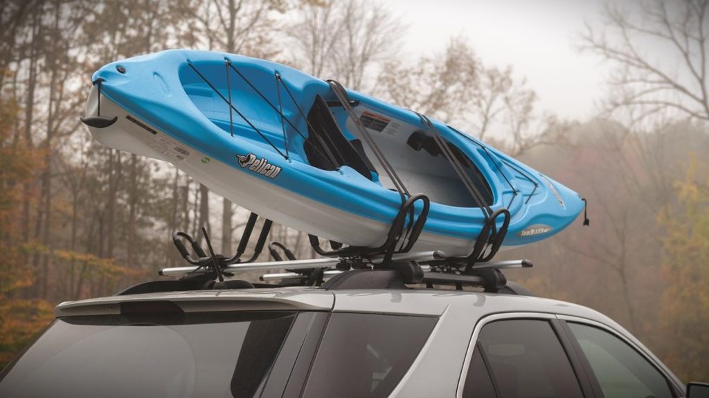 kayak on top of a roof of a car