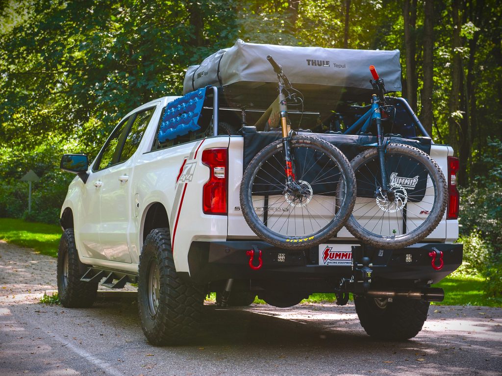 rear view of a chevy silverado loaded with camping gear
