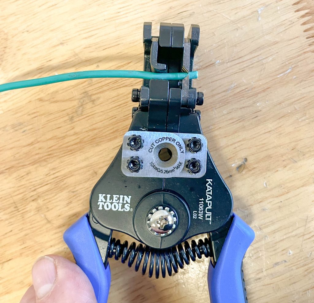 inserting wire into Klein Tools Katapult Wire Strippers