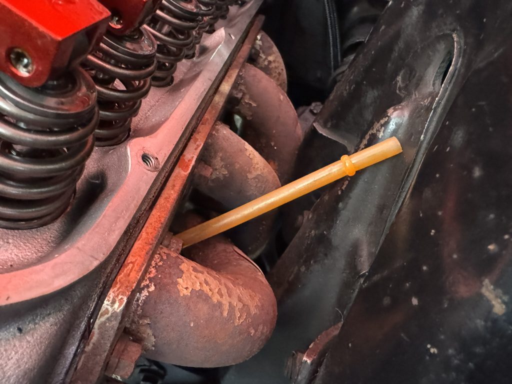 plastic straw wedged in between header primaries