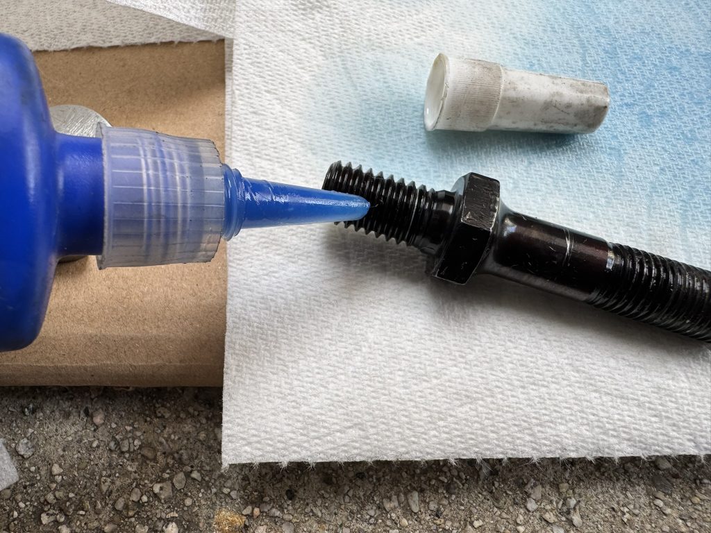 putting thread locker on rocker stud