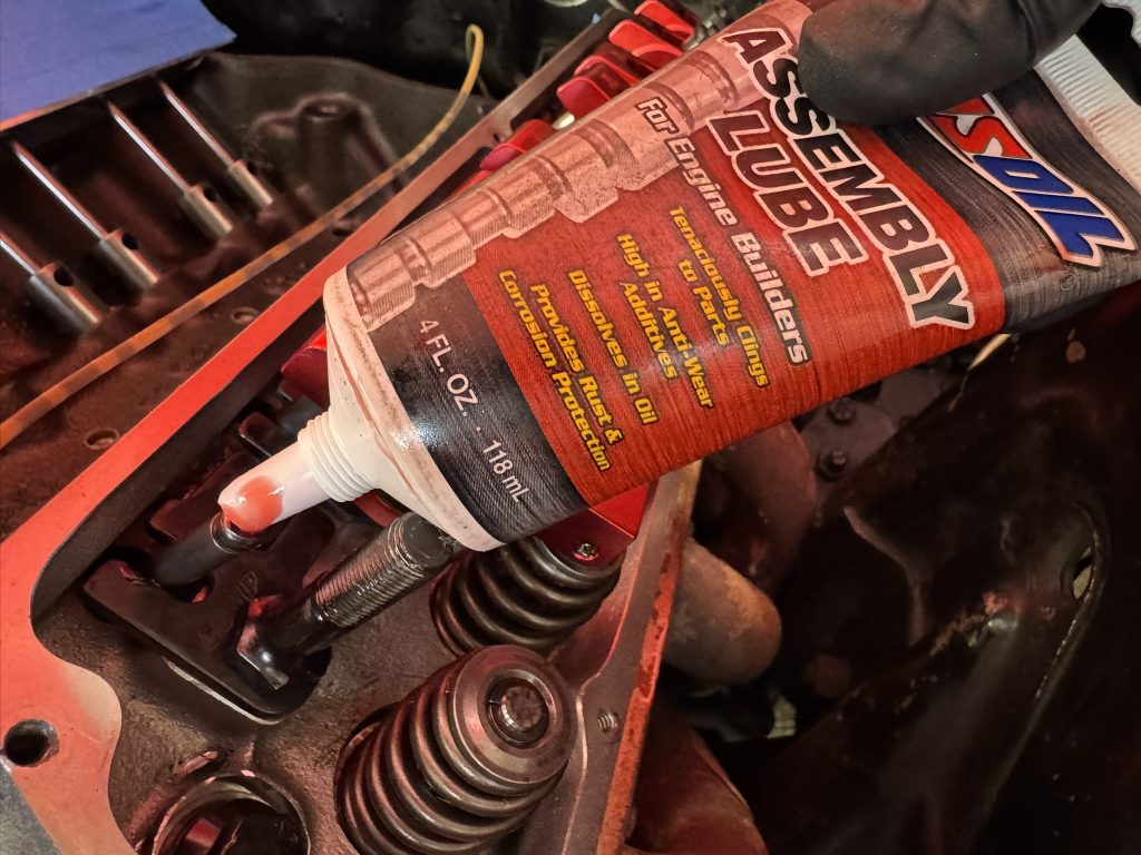 putting assembly lube on a pushrod