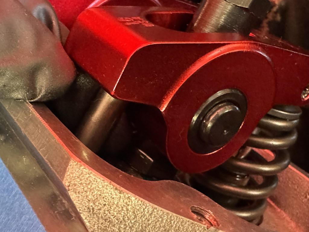 pushrod under a rocker arm in a cylinder head