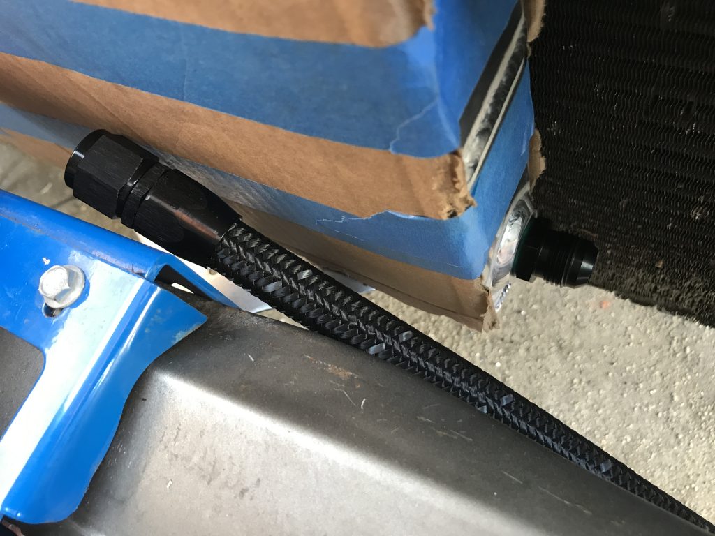 routing plumbing hose near radiator