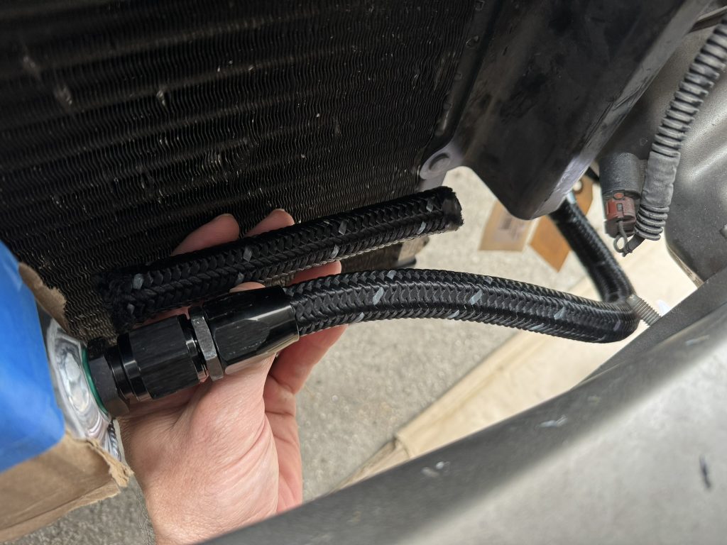 installing plumbing into oil cooler