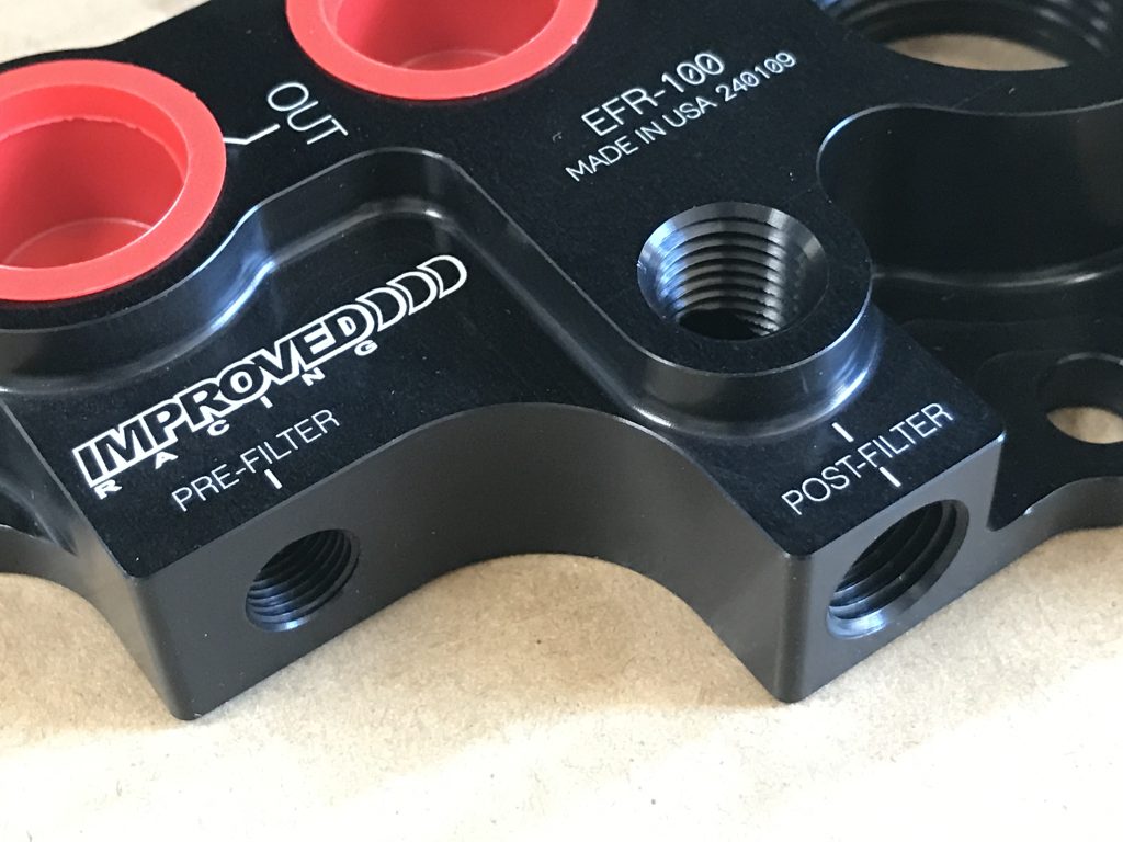 close up of oil cooler plumbing bracket ports