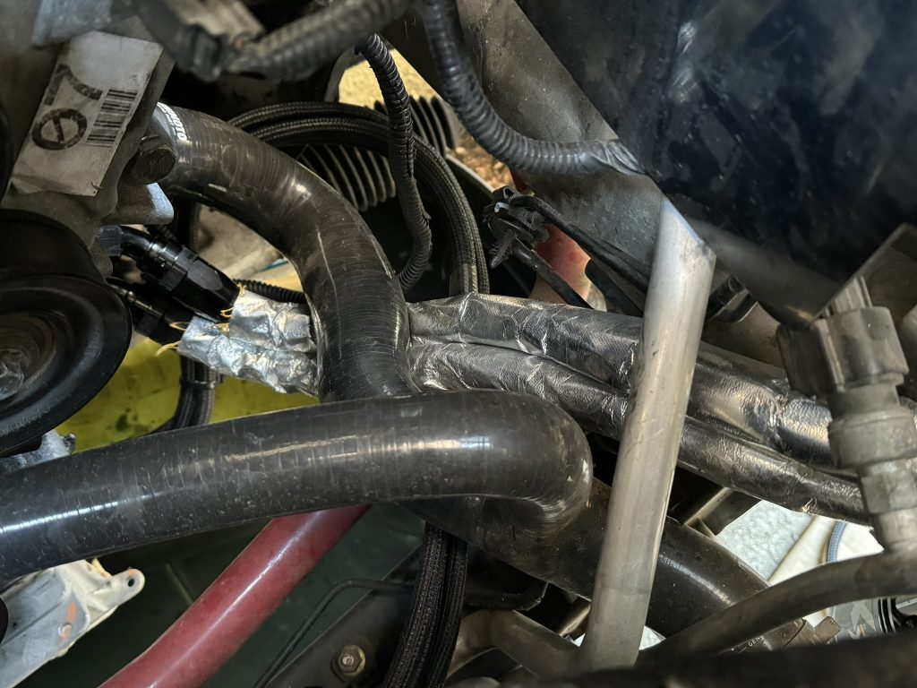 heat shielded oil cooler hose installed